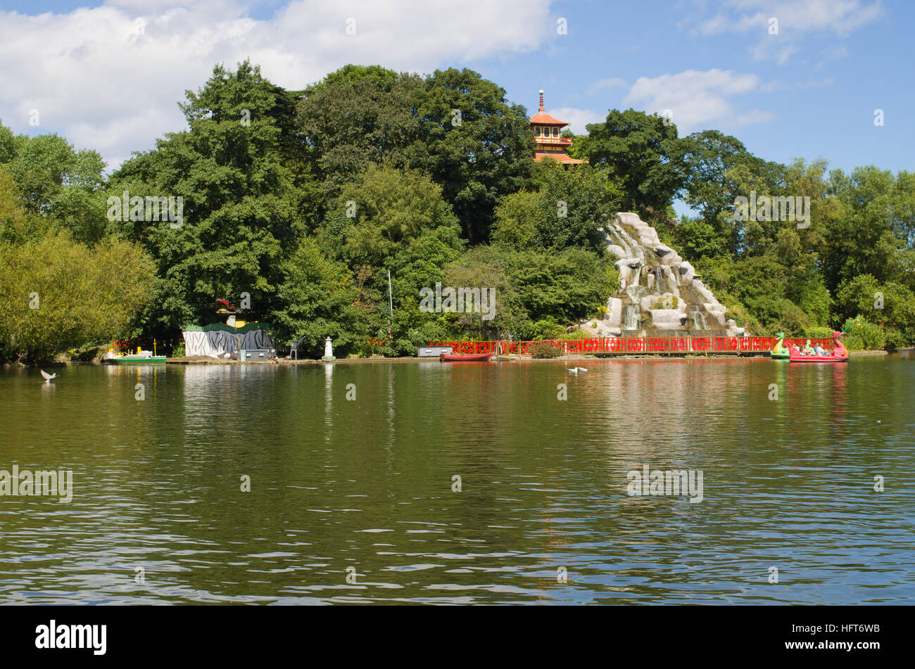 Island with artificial waterfall boating lake Peasholm Park Scarborough UK Stock Photo