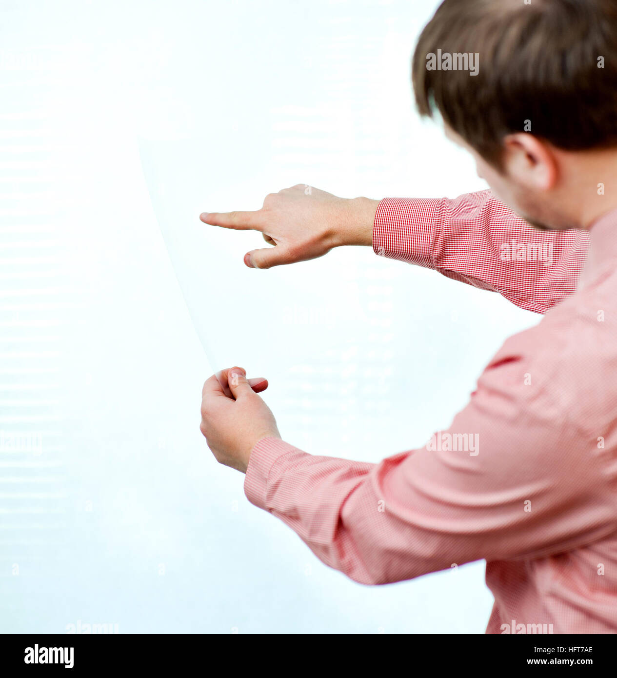 male showing something on transparent paper Stock Photo - Alamy