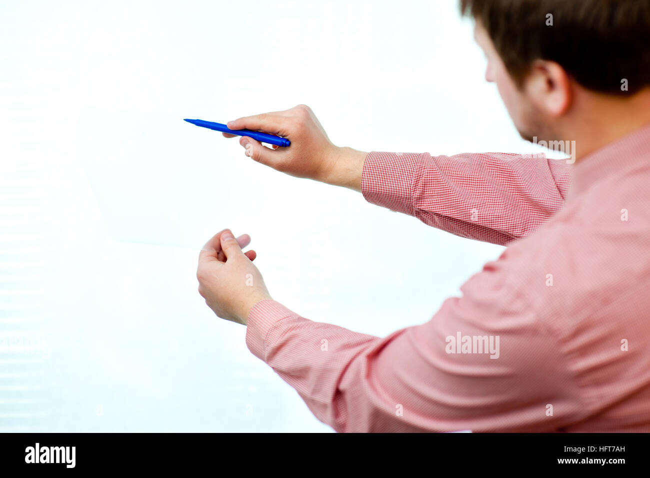 male showing something on transparent paper Stock Photo - Alamy