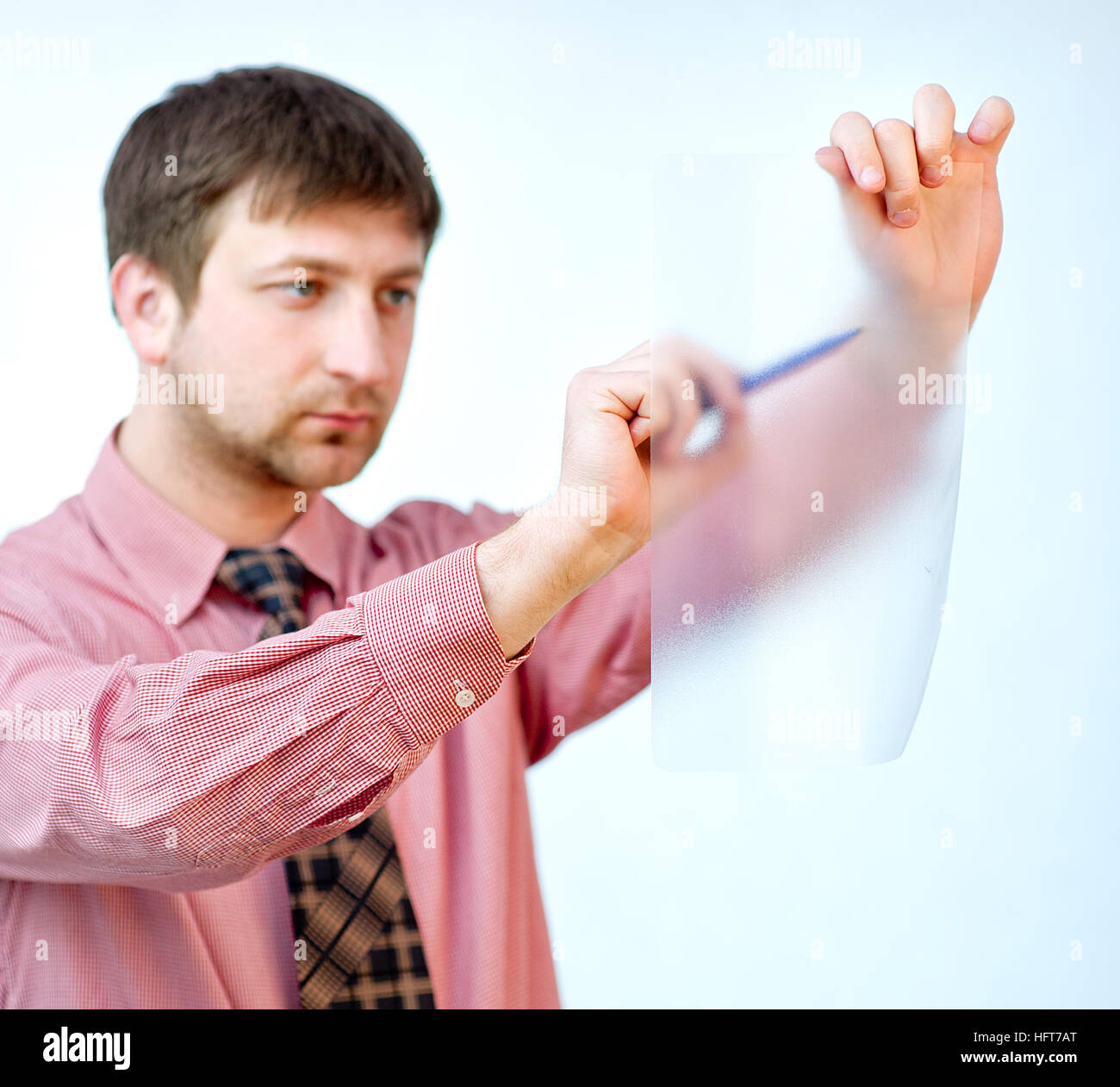 male showing something on transparent paper Stock Photo - Alamy