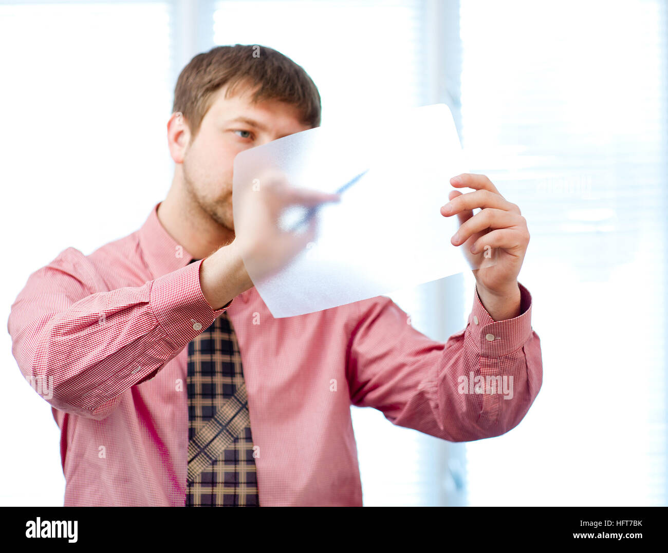 male writing something on transparent paper with Stock Photo - Alamy