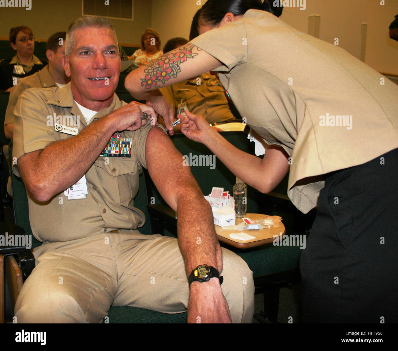 100913-N-8191S-001 BREMERTON, Wash. (Sept. 13, 2010) Capt. Mark E. Brouker, commanding officer of Naval Hospital Bremerton, is vaccinated for influenza during SHOTEX 2010, a mass vaccination exercise for active duty and reserve component shore-based service members and critical civilian personnel.  Naval Hospital Bremerton and Naval Base Kitsap joined local tenant commands to complete the mass vaccination in 48 hours. (U.S. Navy photo by Douglas H. Stutz/Released) US Navy 100913-N-8191S-001 Capt. Mark E. Brouker, commanding officer of Naval Hospital Bremerton, is vaccinated for influenza Stock Photo