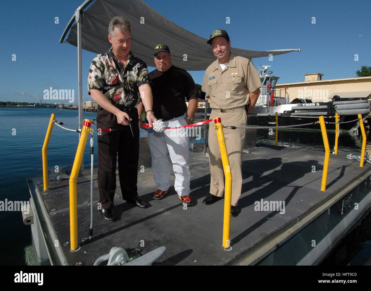 Naval Station Pearl Harbor personnel unveil a new Navy paint float ...