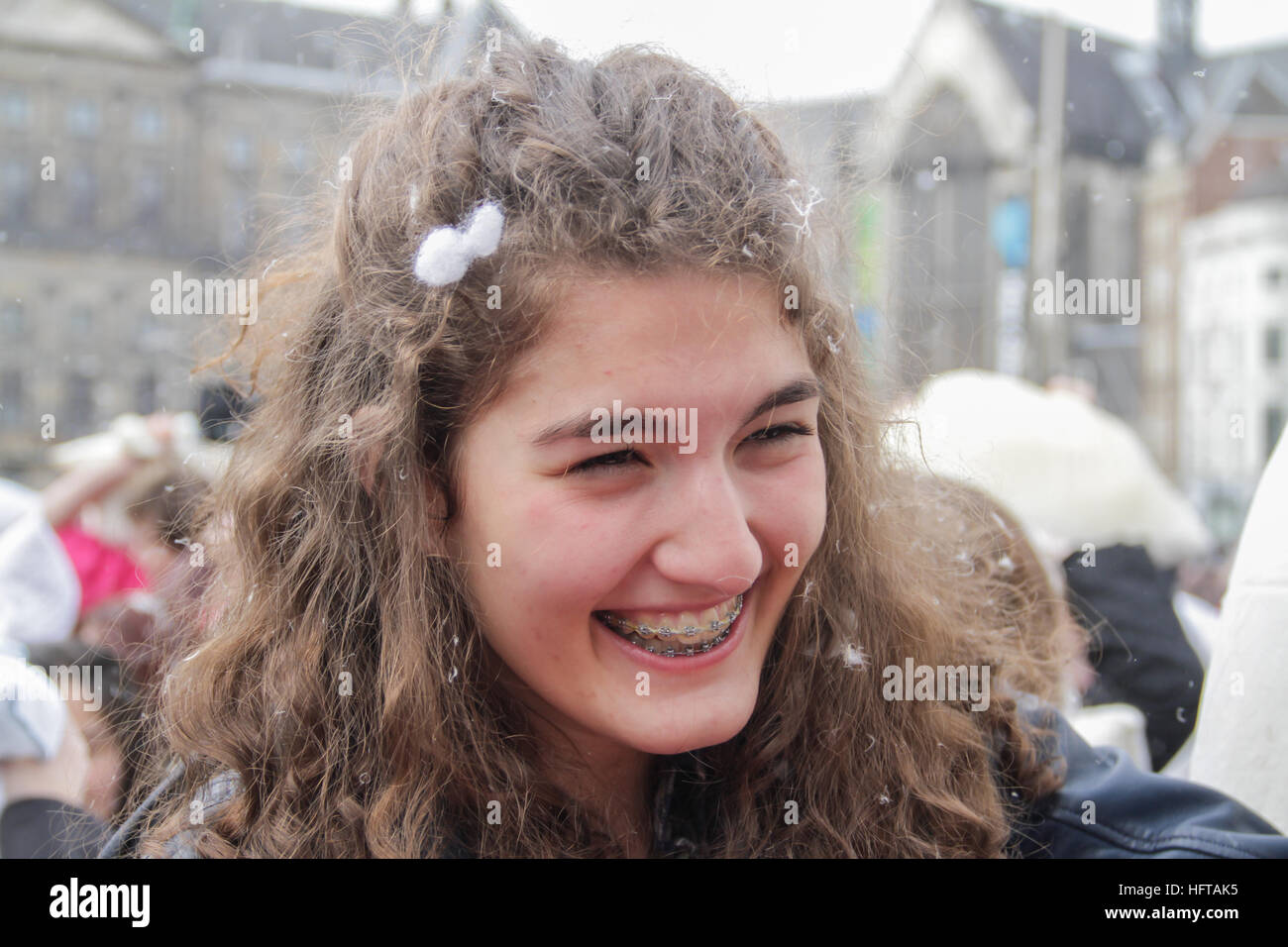 Smiling girl at the pillow fight event Stock Photo