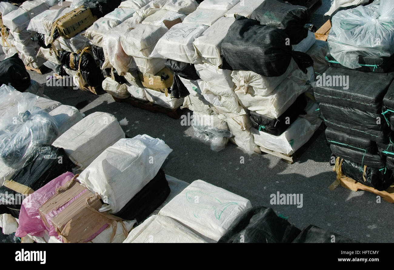 070105-N-5240C-015  Key West, Fla. (Jan. 5, 2007) - Nine tons of cocaine sit on a pier at Naval Air Station Key West. Sailors assigned to the guided missile frigate USS Robert G. Bradley (FFG 49), Coast Guardsmen, and agents from the Drug Enforcement Agency unloaded the cocaine from the ship after a recent drug seizure. Bradley was part of a multi-national and interagency effort to interdict the flow of narcotics into the United States. U.S. Navy photo by Mass Communication Specialist 2nd Class Timothy Cox (RELEASED) US Navy 070105-N-5240C-015 Nine tons of cocaine sit on a pier at Naval Air St Stock Photo