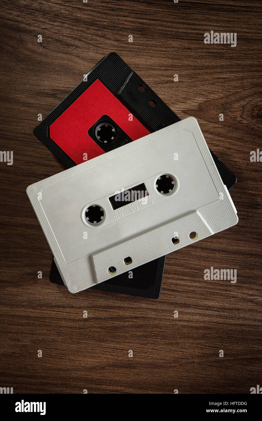 old cassette tapes on wooden background looking down Stock Photo - Alamy