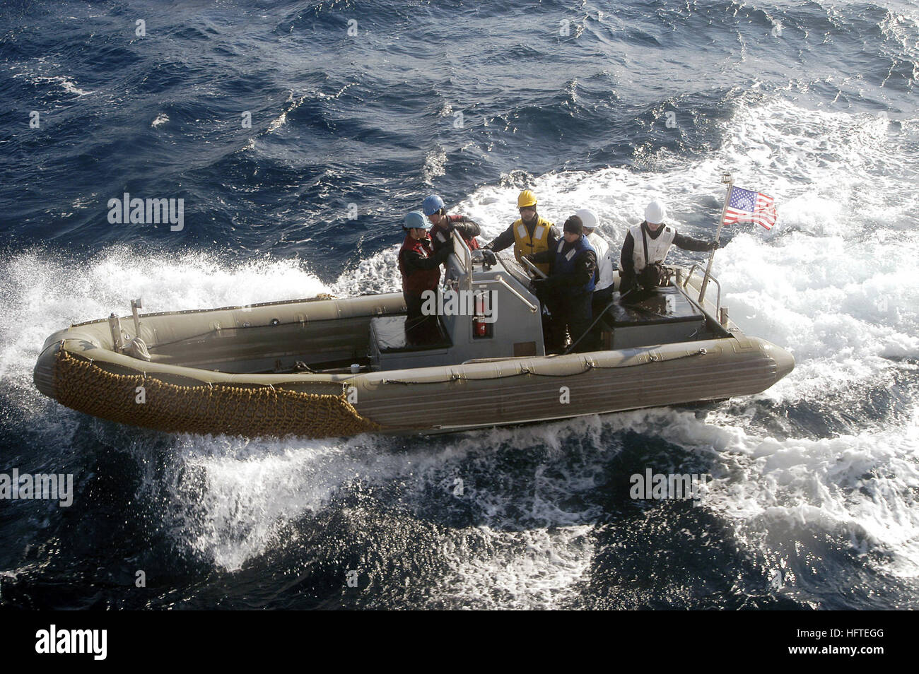Sailors aboard USS Stethem (DDG 63), an Arleigh Burke-class guided ...