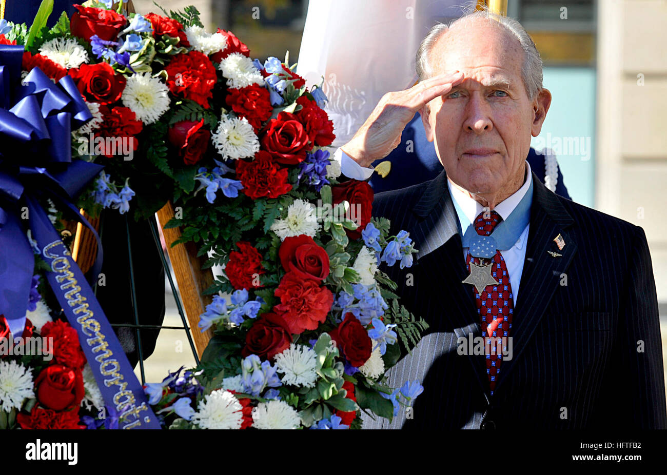 111201-N-KQ655-136  WASHINGTON, D.C. (Dec. 1. 2011) Medal of Honor recipient retired Capt. Thomas Hudner salutes  while taps is played during the Centennial of Naval Aviation Wreath Laying Ceremony held at the United States Navy Memorial in Washington D.C. Hudner received the medal of honor for his heroic efforts as he attempted to rescue Ens. Jesse Brown during the Korean War. (U.S. Navy photo by Mass Communication Specialist 3rd Class Mikelle D. Smith/ Released) US Navy 111201-N-KQ655-136 Medal of Honor recipient retired Capt. Thomas Hudner salutes while taps is played Stock Photo