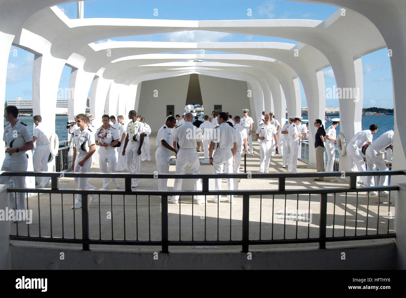 070320-N-6674H-099 PEARL HARBOR, Hawaii (March 20, 2007) - Members of U.S. Naval Academy's Men's Glee Club visit the USS Arizona Memorial to pay their respects to the victims of the Japanese attack on Pearl Harbor. The group toured Hawaii singing at various locales and performed the Navy Hymn at the USS Arizona Memorial to honor the 1,177 Sailors and Marines killed aboard the ship Dec. 7, 1941. U.S. Navy photo by Mass Communication Specialist Seaman Paul D. Honnick (RELEASED) US Navy 070320-N-6674H-099 Members of U.S. Naval Academy's Men's Glee Club visit the USS Arizona Memorial to pay their  Stock Photo