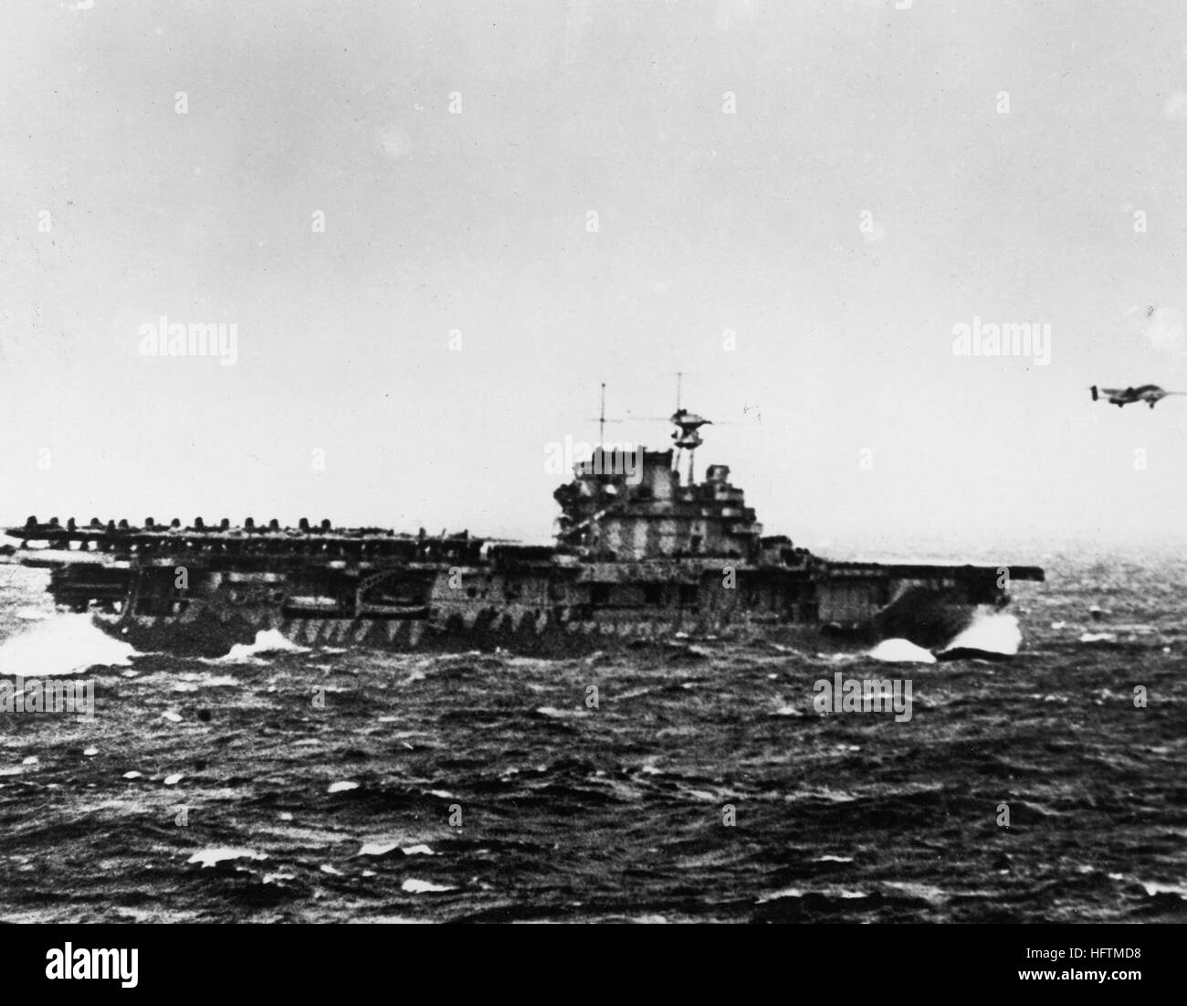 USS HORNET, PACIFIC OCEAN 1942 -- Lt. Col. James 'Jimmy' Doolittle takes off from the USS Hornet 650 miles from Japan on a top-secret bombing mission. The Doolittle Raid, U.S. Army Air Force special order #1 of World War II, was a daring one-way mission of 16 B-25 Mitchell medium bombers with 80 aircrew, commanded by Colonel Doolittle, to carry out America’s first offensive attack on Japan. The crews secretly trained for two-weeks and modified the B-25s at Eglin Air Force Base's Wagner Field, Auxiliary Field 1 prior to the mission. (Photo courtesy National Museum of the U.S. Air Force) USS Hor Stock Photo
