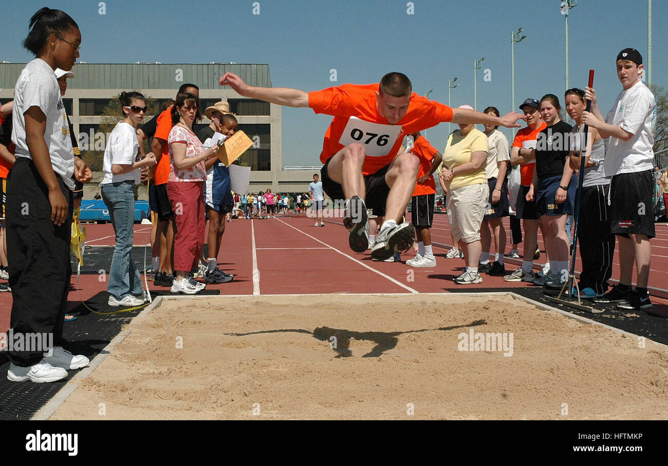 070422-N-5215E-003 ANNAPOLIS, Md. (April 22, 2007) - A Special Olympics athlete participates in the long jump at the Naval Academy. This was the 39th year the Academy hosted the event, which drew 175 athletes from the surrounding area for two days of aquatics and track and field competition. More than 300 Midshipmen, active duty service members, and Annapolis-area high school students volunteered as event staff and athlete escorts for the event. U.S. Navy photo by Mass Communication Specialist Seaman Apprentice Matthew A. Ebarb (RELEASED) US Navy 070422-N-5215E-003 A Special Olympics athlete p Stock Photo