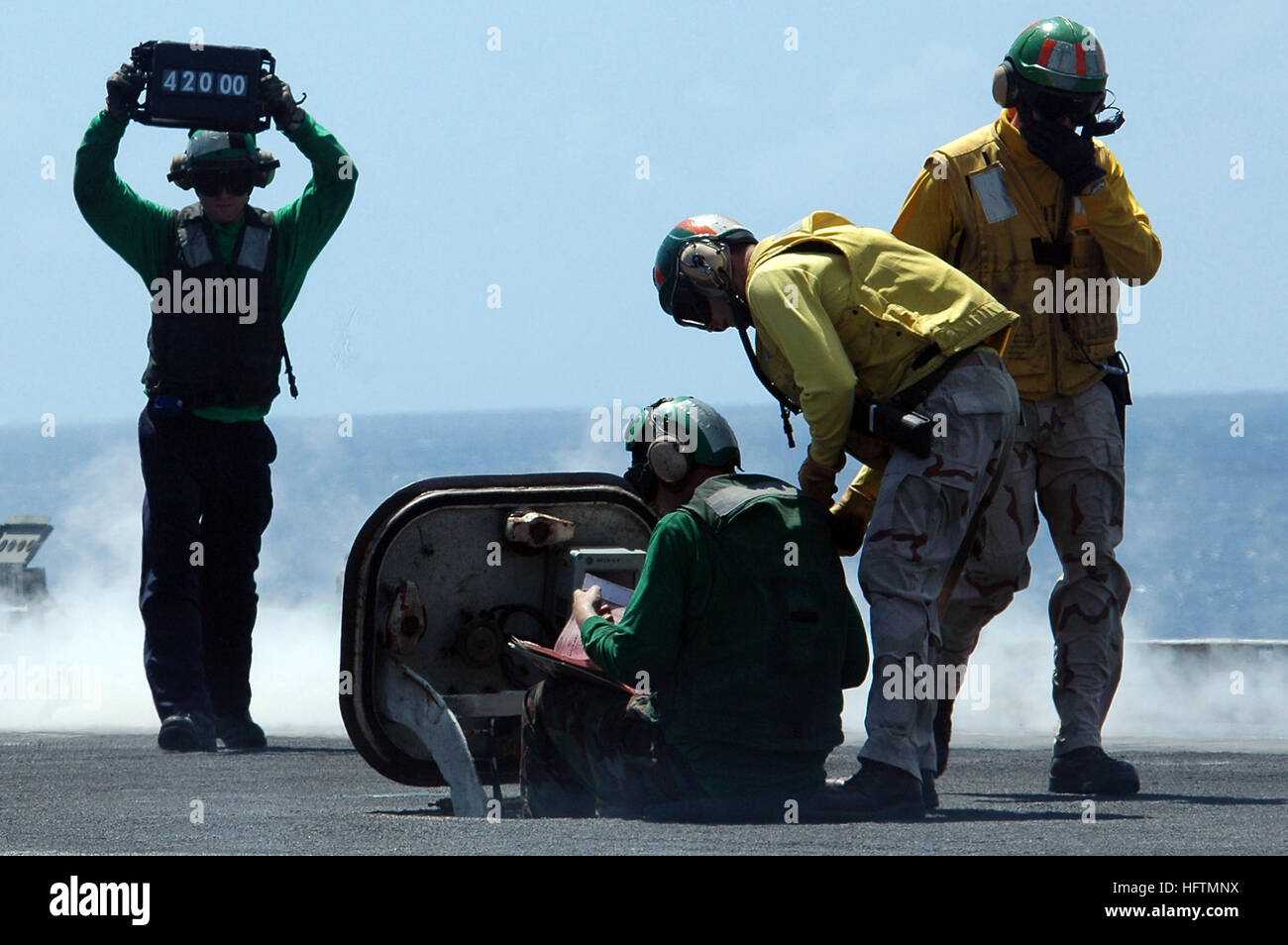 070425-N-9760Z-039 PACIFIC OCEAN (April 25, 2007) - Sailors confirm the weight of an aircraft to assure that the catapult pressure is correct aboard nuclear-powered aircraft carrier USS Nimitz (CVN 68). Nimitz Carrier Strike Group (CSG) is deployed in support of operations in the U.S. Central Command area of responsibility. U.S. Navy photo by Mass Communication Specialist Seaman Eduardo Zaragoza (RELEASED) US Navy 070425-N-9760Z-039 Sailors confirm the weight of an aircraft to assure that the catapult pressure is correct aboard nuclear-powered aircraft carrier USS Nimitz (CVN 68) Stock Photo