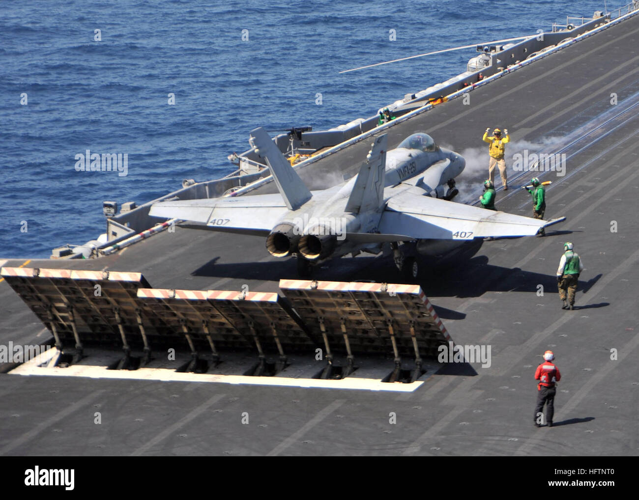 110317-N-0569K-030 RED SEA (March 17, 2011) A shooter signals to the ...