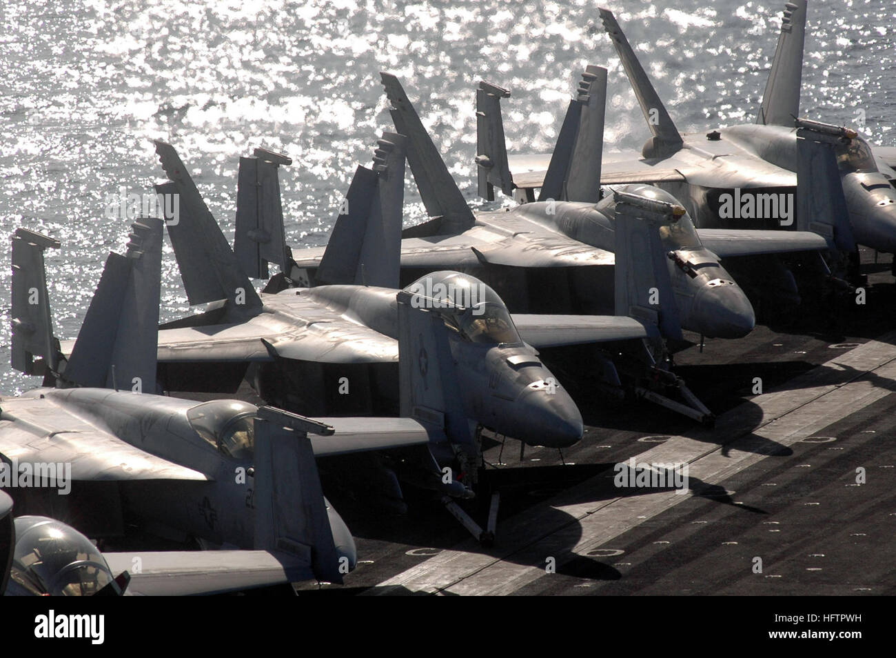 070606-N-0890S-007 PERSIAN GULF (June 6, 2007) - Aircraft line the flight deck of the nuclear-powered aircraft carrier USS Nimitz (CVN 68). The Nimitz Carrier Strike Group and embarked Carrier Air Wing (CVW) 11 are deployed in the U.S. 5th Fleet conducting maritime operations and supporting troops participating in Global War on Terror. U.S. Navy photo by Mass Communication Specialist Seaman Apprentice David L. Smart (RELEASED) US Navy 070606-N-0890S-007 Aircraft line the flight deck of the nuclear-powered aircraft carrier USS Nimitz (CVN 68) Stock Photo