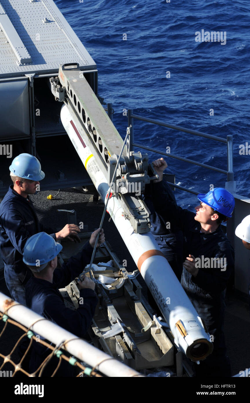 091017-N-0890S-010 CARIBBEAN SEA (Oct. 17, 2009) Sailors load a RIM-7M Sea Sparrow surface-to-air missile into a launcher aboard the multi-purpose amphibious assault ship USS Wasp (LHD 1). Wasp is deployed supporting Southern Partnership Station-Amphibious with Destroyer Squadron 40 and the embarked Security Cooperation Marine Air-Ground Task Force. (U.S. Navy photo by Mass Communication Specialist 3rd Class David Smart/Released) US Navy 091017-N-0890S-010 Sailors load a RIM-7M Sea Sparrow surface-to-air missile into a launcher aboard the multi-purpose amphibious assault ship USS Wasp (LHD 1) Stock Photo