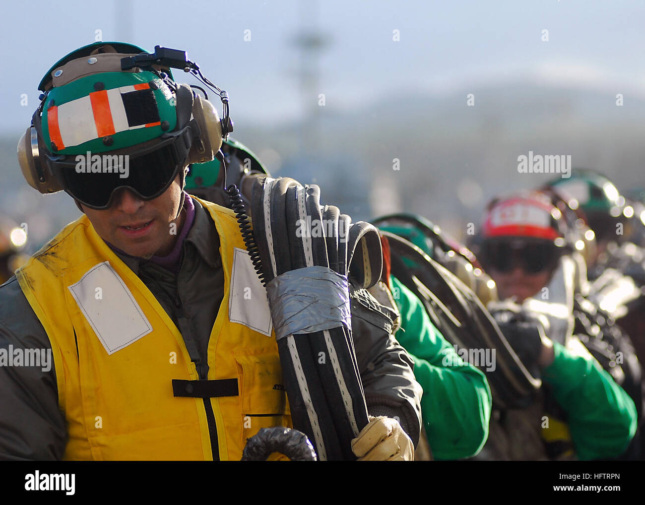Restow USS Abraham Lincoln (CVN 72) Sailors restow emergency barricade ...