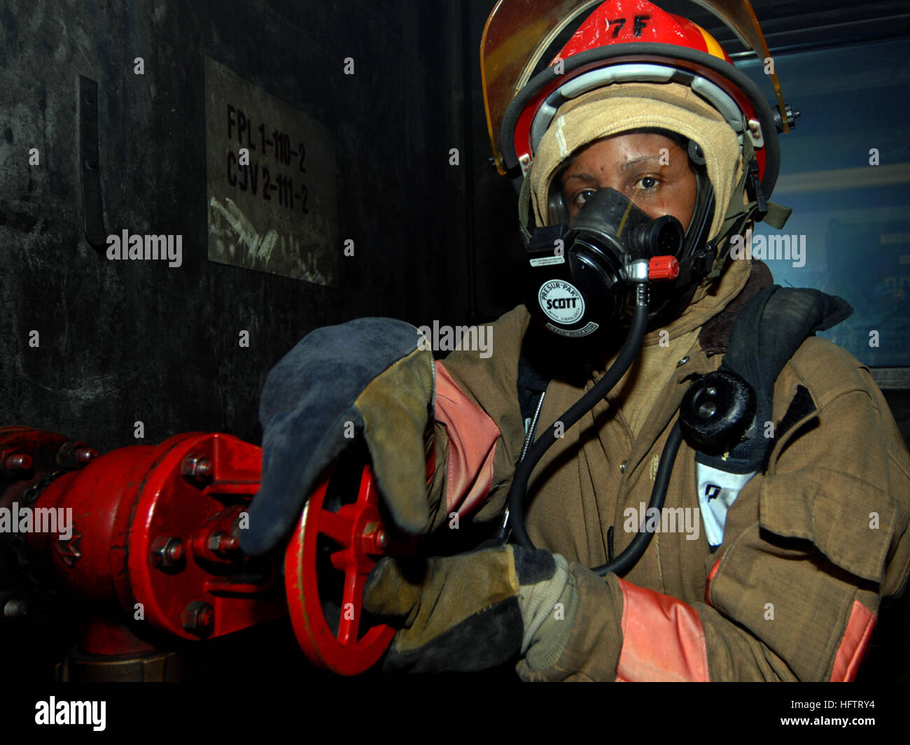 070627-N-4868G-166 NORFOLK, Va. (June 27, 2007) - A damage controlman ...
