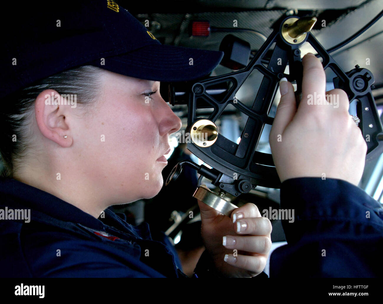 070705-N-9475M-022  ATLANTIC OCEAN (July 5, 2007) - Quatermaster 2nd Class Nichole Lowe uses a stata meter to check the distance between Nimitz-class aircraft carrier USS Harry S. Truman (CVN 75) and Military Sealift Command fleet replenishment oiler USNS Laramie (T-AO 203). Truman pulled alongside the Laramie for replenishment at sea. Truman is underway in the Atlantic Ocean participating in the composite training unit exercise in preparation for deployment to the Persian Gulf. U.S. Navy photo by Mass Communication Specialist 3rd Class Mari Matsumoto Moffitt (RELEASED) US Navy 070705-N-9475M- Stock Photo