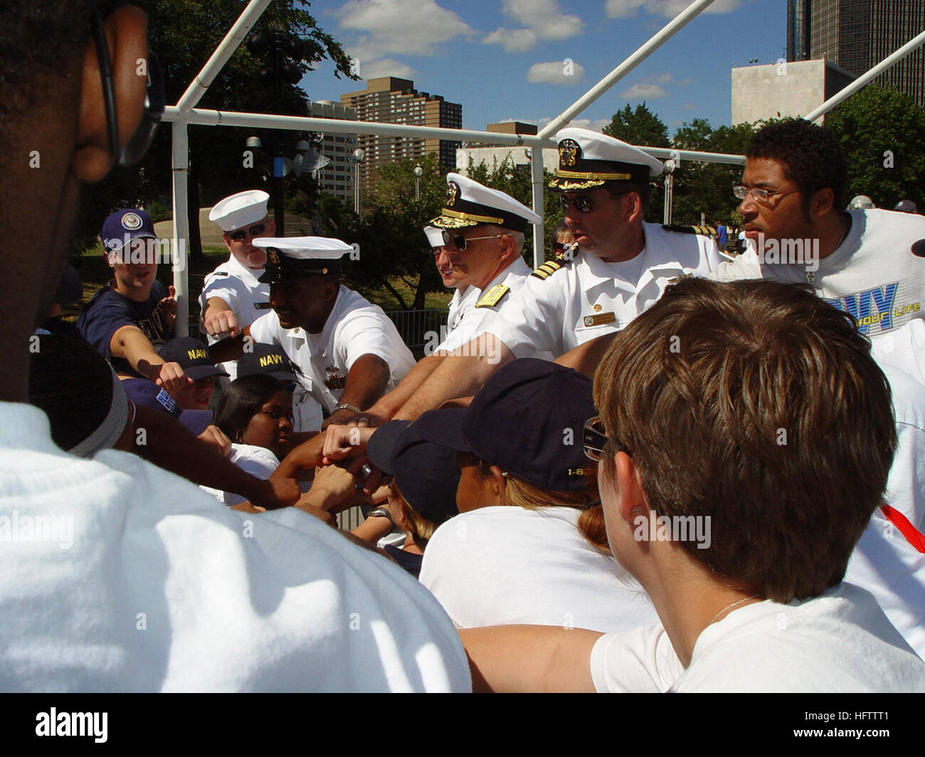 070711-N-2888Q-003  DETROIT (July 11, 2007) - Commander, Naval Surface Forces, Vice Adm. Terrance Etnyre (center) and Commanding Officer, Navy Recruiting District Michigan, Cmdr. Greg Maguire participate in a group hoorah with Delayed Entry Program members aboard U.S. Naval Sea Cadet training ship Grayfox (TWR 825). Grayfox is conducting cruises at part of Navy Week Detroit. The week is one of 26 Navy Weeks planned across America in 2007. Navy Weeks are designed to show Americans the investment they have made in their Navy and increase awareness in cities that do not have a significant Navy pr Stock Photo