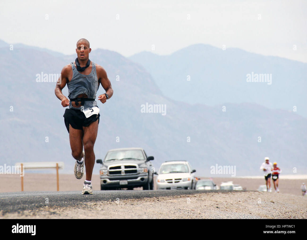 070723-N-6138R-001  SAN DIEGO (July 23, 2007) - U.S. Navy SEAL, Petty Officer 1st Class David Goggins runs 135 miles through Death Valley, California in the Kiehl's Badwater Ultra Marathon that began in the Badwater Basin, the lowest point in the United States. Goggins finished the race in 3rd place 25 hours later on top of Mount Whitney, the highest point in the Continental United States. Goggins final time was a 4-hour improvement over his 2006 5th place finish. U.S. Navy photo by Mass Communication Specialist Seaman Brandon Rogers (RELEASED) US Navy 070723-N-6138R-001 U.S. Navy SEAL, Petty  Stock Photo