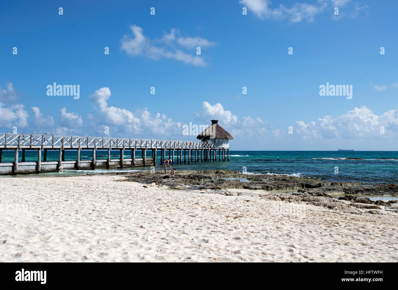 Mexico Caribbean Ocean beach pier vacation. Luxury resort Mexican Mayan Riviera Cancun. Swimming , beach, tropical jungle activities. Stock Photo