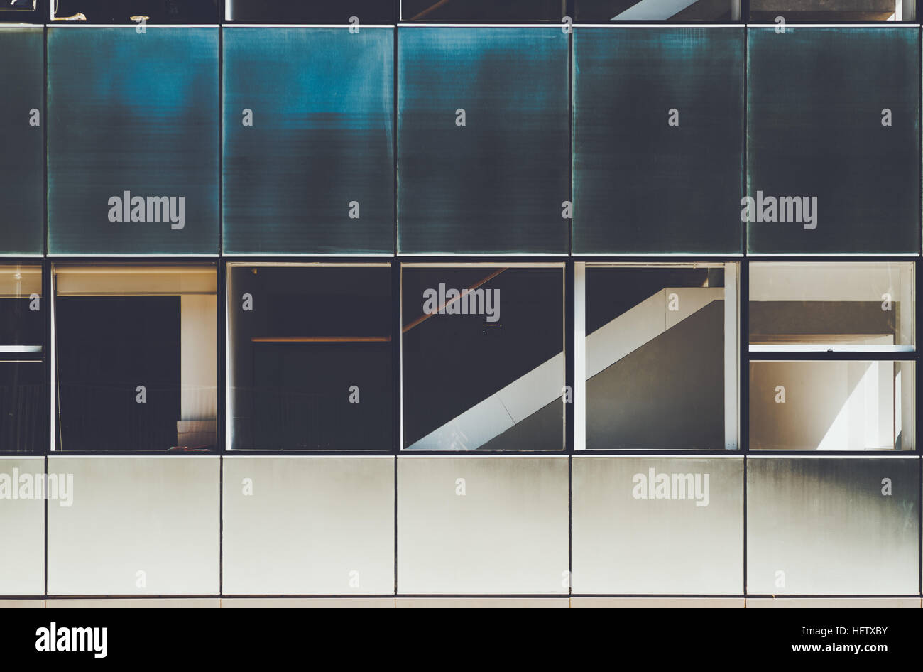 Blue and white modern facade of contemporary building with several rows ...