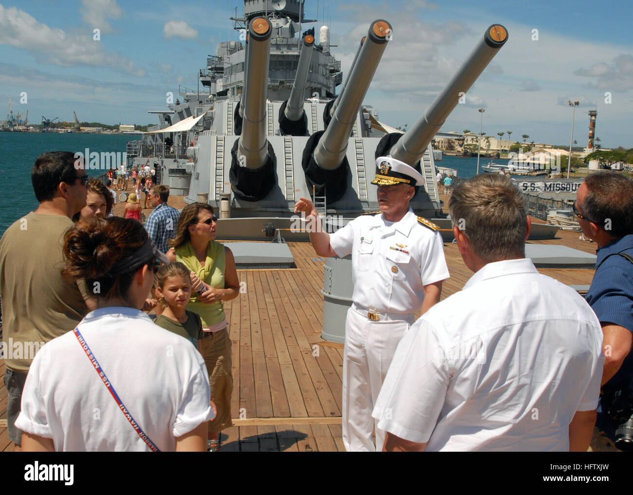 Commander, U.S. Pacific Fleet Adm. Robert Willard greets visitors of the Battleship Missouri Memorial following a ceremony held aboard for newly promoted Petty Officer Michael Giorgione, the Pacific Fleet civil engineer. During Willard's brief walk about the vessel, he spoke of the pride he feels to command the world's largest fleet. Willard gives thanks DVIDS58728 Stock Photo