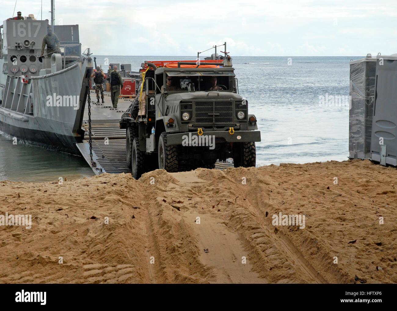 Crew members unload cargo hi-res stock photography and images - Alamy