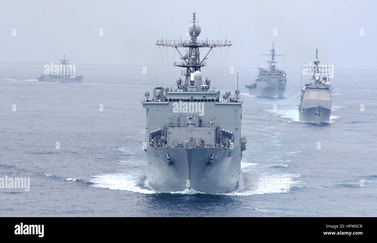 The dock landing ship USS Germantown (LSD 42) leads other ships assigned to the amphibious assault ship USS Tarawa (LHA 1)'s battle group during a strait transit exercise in the Pacific Ocean off the coast of southern California Sept. 18, 2007. Tarawa is participating in a composite unit training exercise with the 11th Marine Expeditionary Unit. (U.S. Navy photo by Mass Communication Specialist 3rd Class Daniel A. Barker) USS Germantown 070918-N-RI884-052 Stock Photo