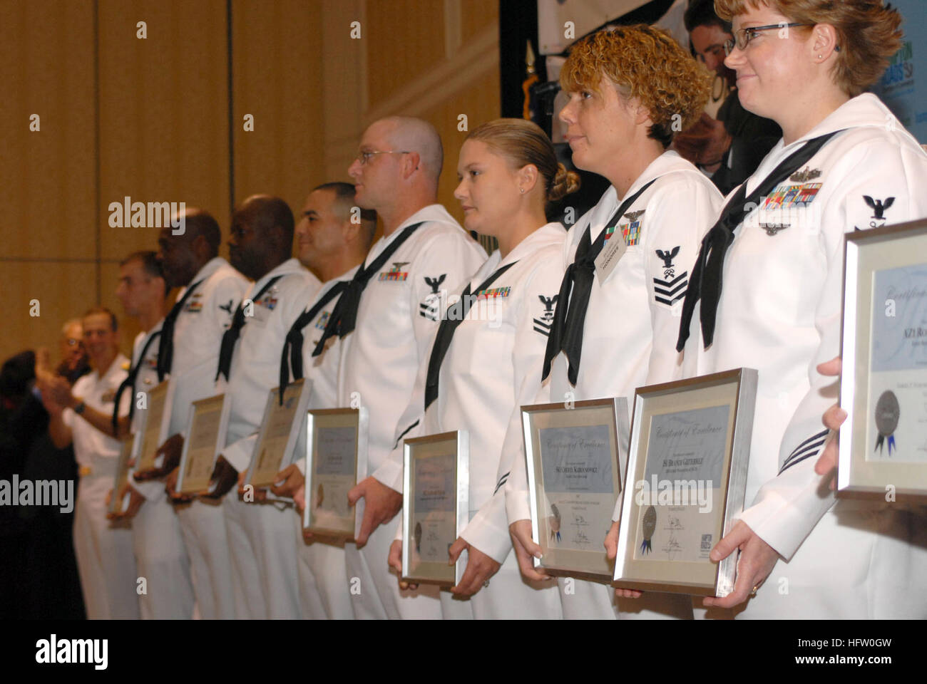 071011-N-8907D-037 NORFOLK, Va. (Oct. 11, 2007) - Nine finalists stand before the crowd at the Norfolk Waterside Marriot after being nominated for Military Citizen of the Year (MCOY). The MCOY award recognizes Sailors who have outstanding reputations for helping the community through volunteer work. U.S. Navy photo by Mass Communication Specialist 3rd Class David Danals (RELEASED) US Navy 071011-N-8907D-037 Nine finalists stand before the crowd at the Norfolk Waterside Marriot after being nominated for Military Citizen of the Year (MCOY) Stock Photo