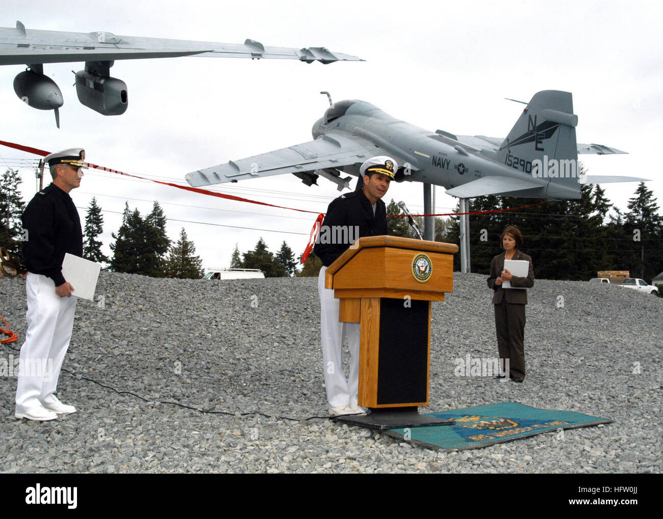 070920-N-9860Y-003 OAK HARBOR, Wash. (Sept. 20, 2007) - Capt. Thomas Tack, commodore of Electronic Attack Wing Pacific, speaks at the ribbon-cutting ceremony for the Naval Air Station (NAS) Whidbey Island Gateway under an A-6 Intruder and EA-6B Prowler display. Oak Harbor Mayor Patty Cohen and Capt. Gerral K. David, commanding officer of NAS Whidbey Island, were also in attendance. The Gateway was a joint venture by the local Oak Harbor community and NAS Whidbey Island to commemorate the bond between the two communities. U.S. Navy photo by Mass Communication Specialist 2nd Class Tucker M. Yate Stock Photo