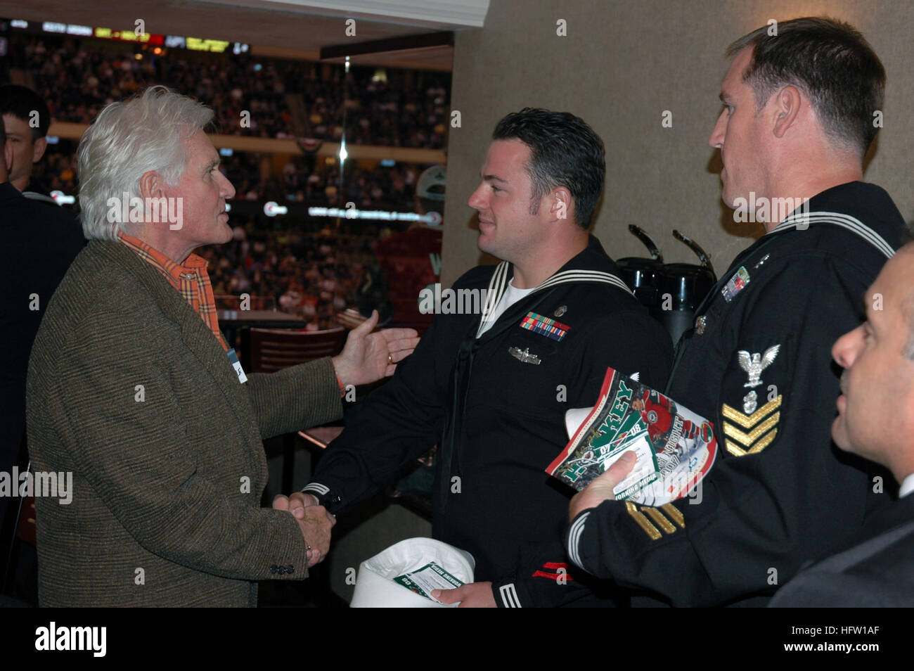 071004-N-7006N-002  ST. PAUL, Minn. (Oct. 4, 2007) - Navy divers assigned to Mobile Diving and Salvage Unit (MDSU) 2, meet Minnesota Wild owner Bob Naegle during the WildÕs season opening NHL hockey game against the Chicago Blackhawks. Six MDSU-2 divers returned to the area to participate in Twin Cities Navy Week after spending much of August assisting local, state and federal authorities find missing victims in the wake of the I-35W bridge collapse in Minneapolis. Navy Weeks are designed to show Americans the investment they have made in their Navy and to increase awareness in cities that do  Stock Photo