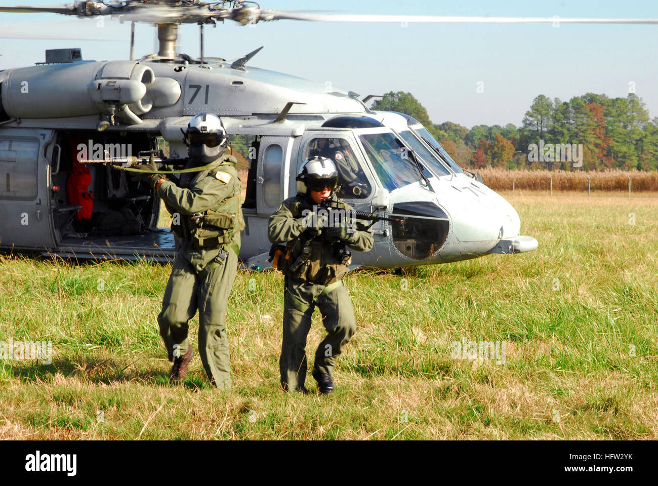 Helicopter Sea Combat Squadron 26 personnel conduct a ground rescue ...