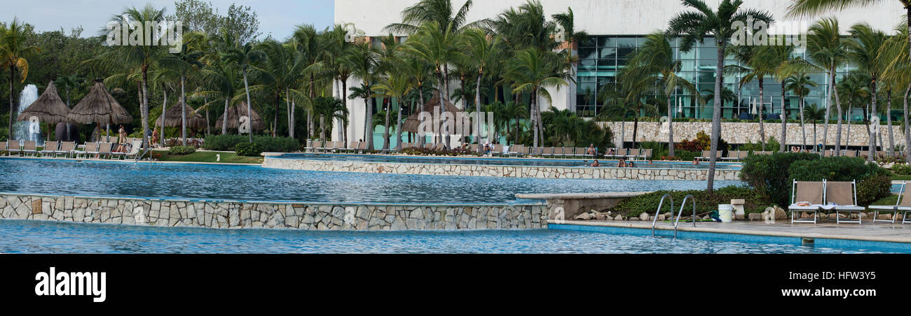 Mexico tropical resort swimming pool. Luxury resort on Mexican Mayan Riviera near Cancun. Swimming pools, beach, tropical jungle and warm recreation. Stock Photo