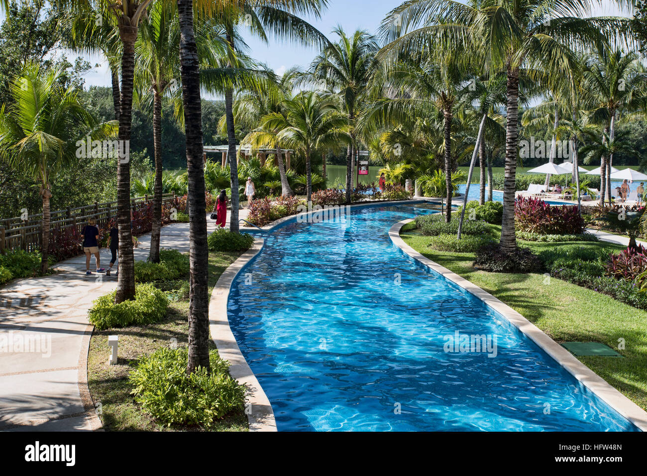 Vacation luxury resort hotel swimming pool Mexico. Beautiful vacation destination on coast of Pacific Ocean in Puerto Vallarta, Mexico. Stock Photo