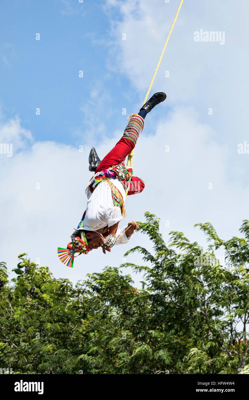 Tulum Mexico acrobat men high rope swing dangerous. Pre Columbian Mayan