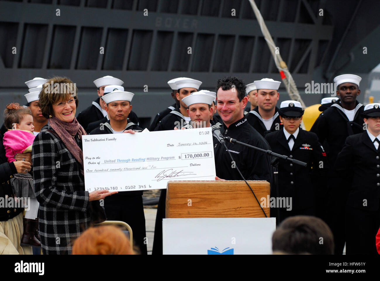 U.S. Navy photo by Mass Communication Specialist 2nd Class (SW/AW) Jon Rasmussen US Navy 080123-N-9150R-033 Professional golfer, Rory Sabbatini, presents a check for $170,000 to the United Through Reading (UTR) program while visiting amphibious assault ship USS Boxer (LHD 4) Stock Photo