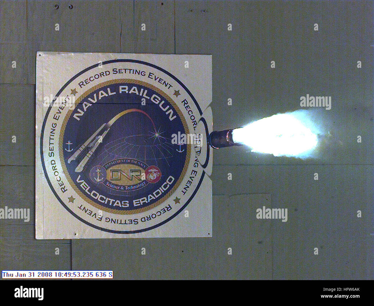 080131-N-0000X-004   DAHLGREN, Va. (Jan. 31, 2008) Photograph taken from a high-speed video camera during a record-setting firing of an electromagnetic railgun (EMRG) at Naval Surface Warfare Center, Dahlgren, Va., on January 31, 2008, firing at 10.64MJ (megajoules) with a muzzle velocity of 2520 meters per second. The Office of Naval Research’s EMRG program is part of the Department of the Navy’s Science and Technology investments, focused on developing new technologies to support Navy and Marine Corps war fighting needs. This photograph is a frame taken from a high-speed video camera. U.S. N Stock Photo