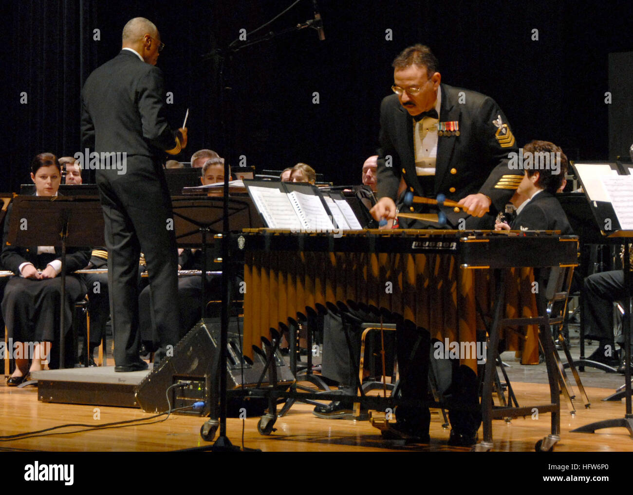 The Navy Band performs swing-era music on vibraphone at Great Mills High School as part of outreach concerts in the national capital region, showcasing military musical programs and community engagement. Stock Photo