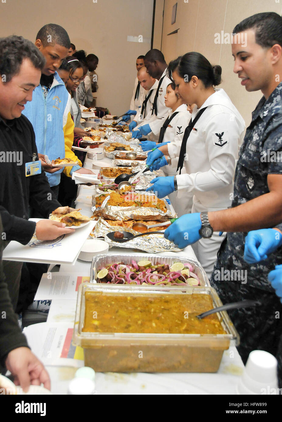 091002-N-2541H-008 PORTSMOUTH, Va. (Oct. 2, 2009) Members of the Command Diversity Committee serve  ethnic dishes from 11 different Latin countries to attendees of the Hispanic American Heritage Month ceremony in the Naval Medical Center Portsmouth auditorium. (U.S. Navy photo by Mass Communication Specialist 2nd Class William Heimbuch/Released) US Navy 091002-N-2541H-008 Members of the Command Diversity Committee serve ethnic dishes from 11 different Latin countries to attendees of the Hispanic American Heritage Month ceremony in the Naval Medical Center Portsmouth a Stock Photo