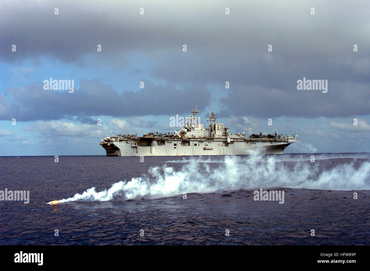 050613-N-6482W-034   Atlantic Ocean (June 13, 2005) - An MK-92 flare signals the approximate location of the search and rescue training aide, 'Oscar,' during a man overboard drill aboard the amphibious assault ship USS Bataan (LHD 5). Bataan is currently underway for the final test and evaluation period for the MV-22 Osprey tilt-rotor aircraft. U.S. Navy photo by Lithographer 3rd Class Justin S. Webster (RELEASED) US Navy 050613-N-6482W-034 An MK-92 flare signals the approximate location of the search and rescue training aide, Oscar, during a man overboard drill Stock Photo