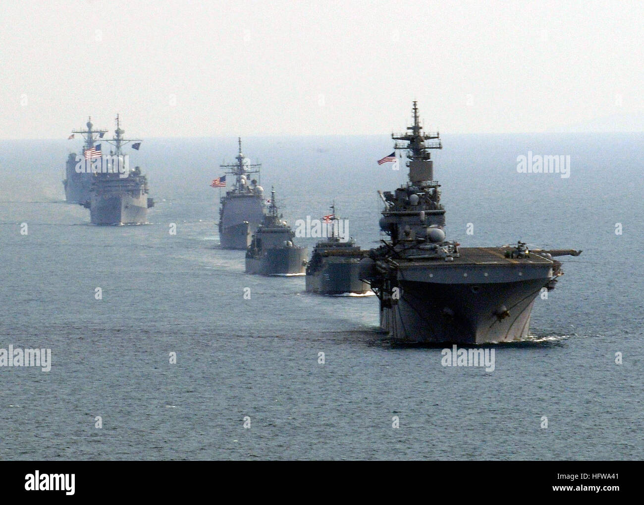 100208-N-9418A-572 GULF OF THAILAND (Feb. 8, 2010) The forward-deployed amphibious assault ship USS Essex (LHD 2), the Royal Thai navy medium landing ship HTMS Surin (LST 722), the Republic of Korea navy tank landing ship Seongin Bong (LST 685), the Ticonderoga-class guided-missile cruiser USS Shiloh (CG 67), the forward-deployed amphibious dock landing ship USS Harpers Ferry (LSD 49) and the forward-deployed amphibious transport dock ship USS Denver (LPD 9) transit in formation in the Gulf of Thailand during exercise Cobra Gold 2010. (U.S. Navy photo by Mass Communication Specialist 3rd Class Stock Photo