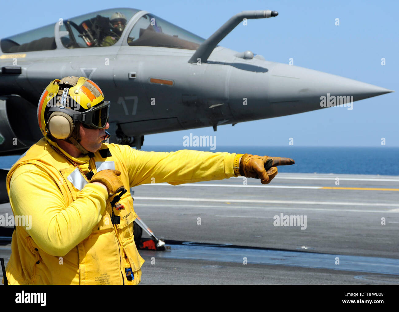 A shooter launches a French F-2 Rafale aircraft under supervision ...