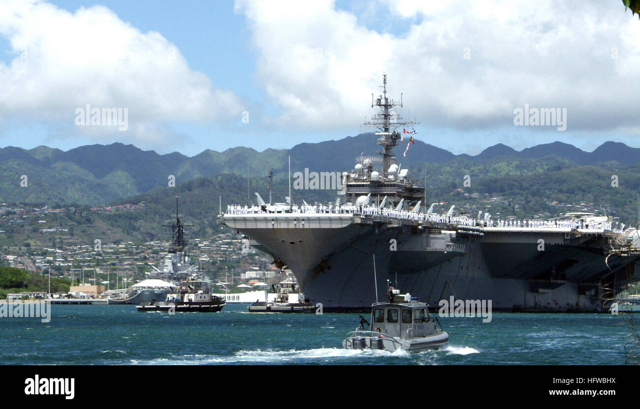 080801-N-0879R-003 PEARL HARBOR, Hawaii (Aug. 1, 2008) The aircraft carrier USS Kitty Hawk (CV 63) departs Pearl Harbor after a brief port visit after the conclusion of Rim of the Pacific (RIMPAC) 2008. RIMPAC is the world's largest multinational exercise and is scheduled biennially by the U.S. Pacific Fleet. Participants include the United States, Australia, Canada, Chile, Japan, the Netherlands, Peru, Republic of Korea, Singapore, and the United Kingdom. This was Kitty Hawk's last exercise before returning to the U.S. mainland for decommissioning in early 2009. Kitty Hawk will be replaced by Stock Photo