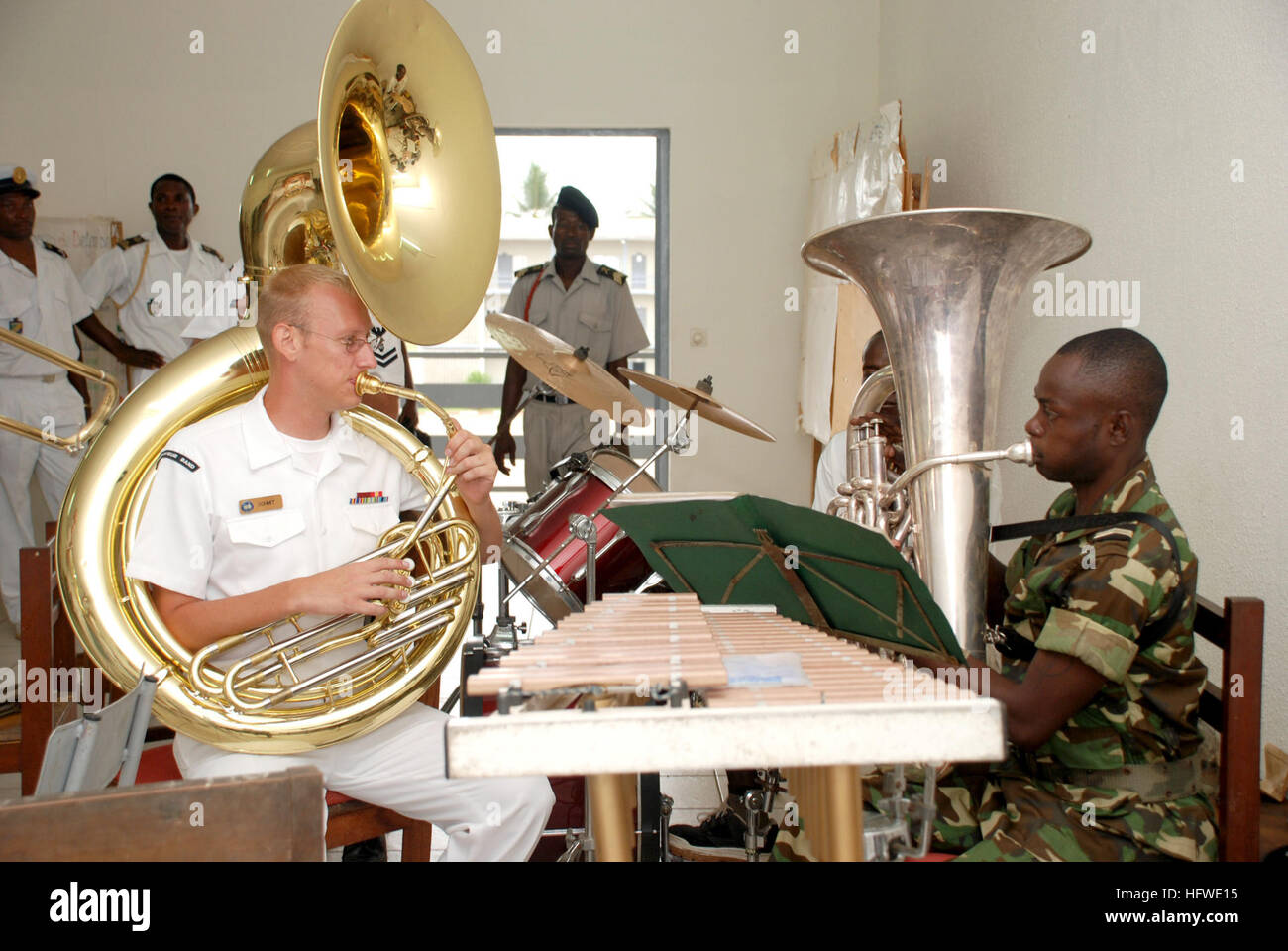 080915-N-6544L-480 LIBREVILLE, Gabon (Sept. 15, 2008) Sousaphone player Musician 3rd Class Nick Schmit, left, and Gabonese Army tuba player Sgt. Minko Gontran play together at the Prytanee School during a community relations project. The Commander, U.S. Naval Forces Europe brass quintet exchanged music with their Gabonese counterparts and played for students at the school as part of the Africa Sports Diplomacy Tour, which aims to improving understanding and developing goodwill between the U.S. and its partner nations in West and Central Africa. (U.S. Navy photo by Mass Communication Specialist Stock Photo
