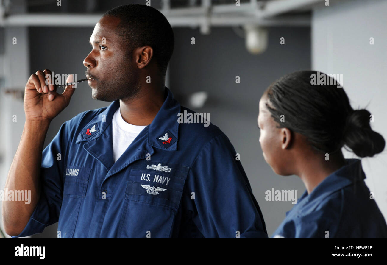 080915-N-9116H-006 ATLANTIC OCEAN (Sept. 15, 2008) Boatswain's Mate Rashad Williams blows a boatswain's pipe in the fantail of the aircraft carrier USS Theodore Roosevelt (CVN 71). The Nimitz-class aircraft carrier and embarked Carrier Airwing (CVW) 8 are on a scheduled deployment. (U.S. Navy photo by Mass Communication Specialist 3rd Class Wilyanna Harper/Released) US Navy 080915-N-9116H-006 Boatswain's Mate Rashad Williams blows a boatswain's pipe in the fantail of the aircraft carrier USS Theodore Roosevelt (CVN 71) Stock Photo