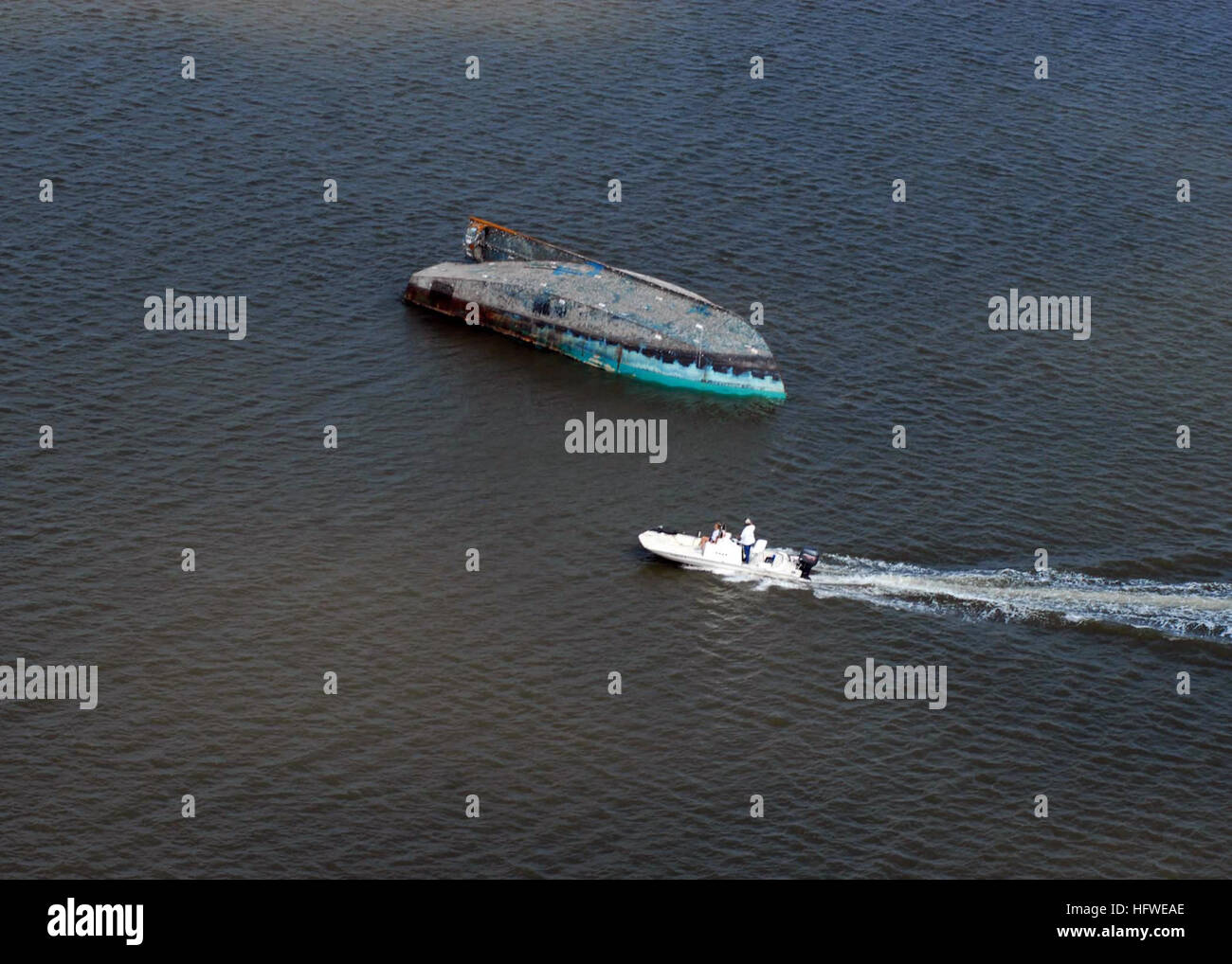 080919-N-6575H-703 GALVESTON, Texas (Sept. 19, 2008) In this aerial photograph, a capsized boat is seen adrift in Galveston Bay. Hurricane Ike struck the Texas Gulf Coast as a strong category 2 storm Sept. 13, causing wide-spread damage to the region. (U.S. Navy photo by Chief Mass Communication Specialist Chris Hoffpauir/Released) US Navy 080919-N-6575H-703 In this aerial photograph, a capsized boat is seen adrift in Galveston Bay Stock Photo