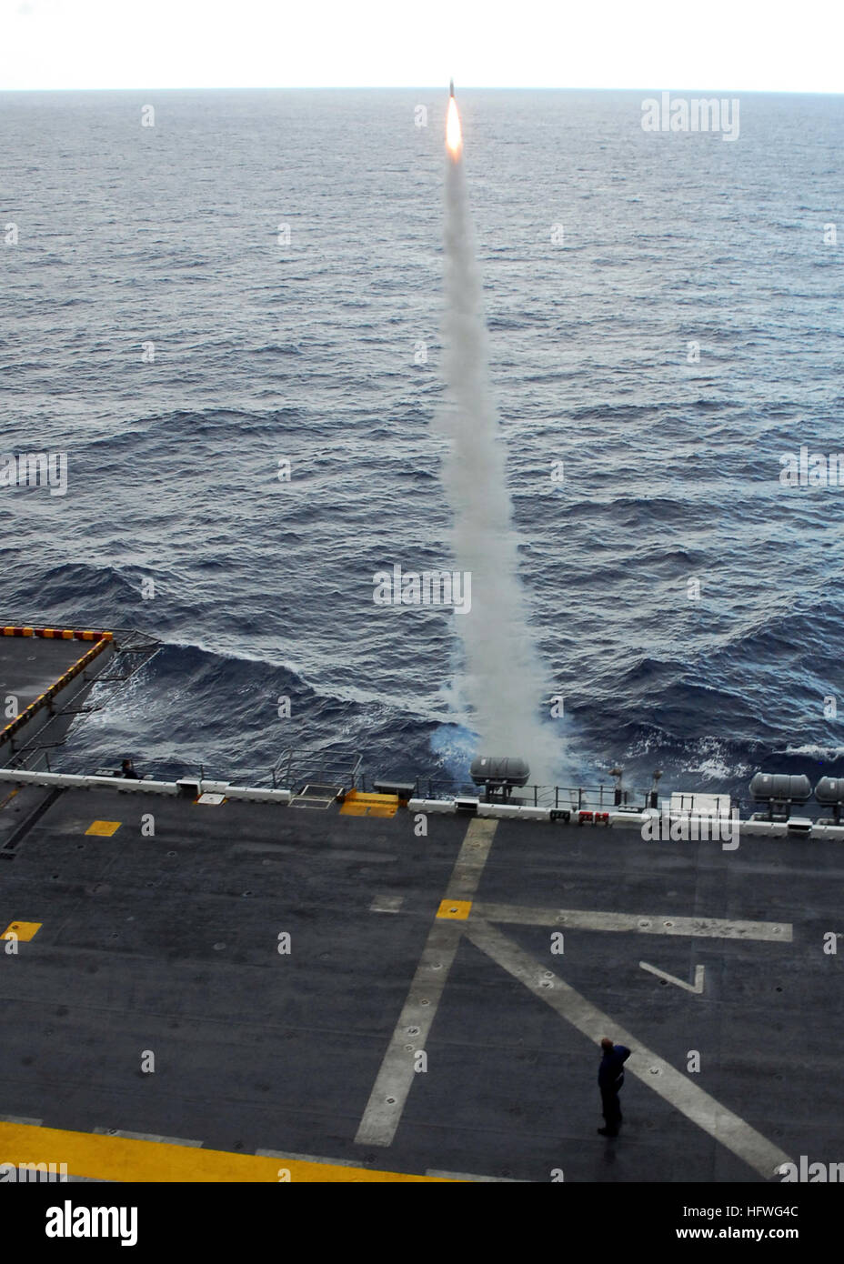 USS Peleliu (LHA 5) launches a chaff radar countermeasure rocket during ...