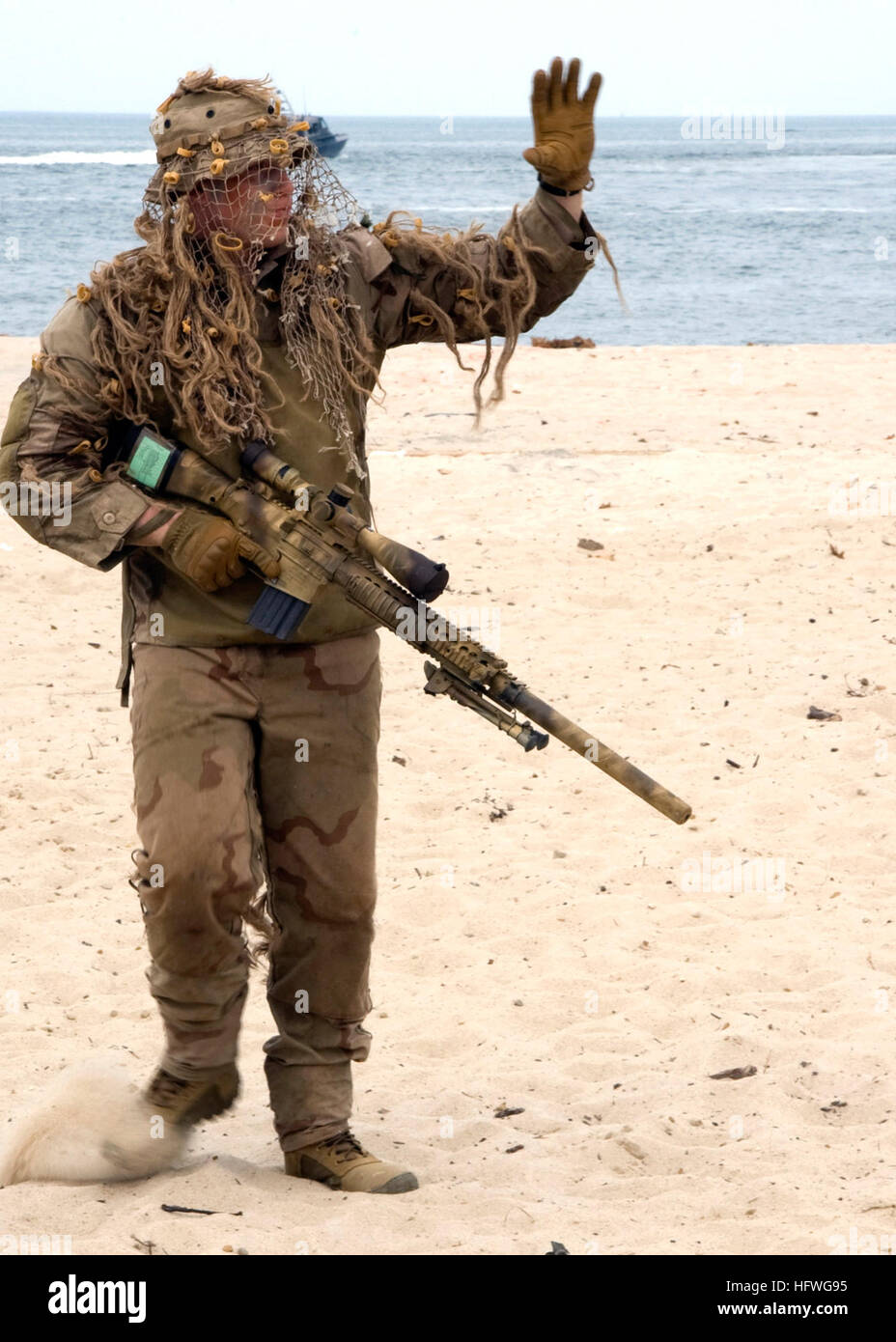 A U.S. Navy SEAL sniper demonstrates operational capabilities to