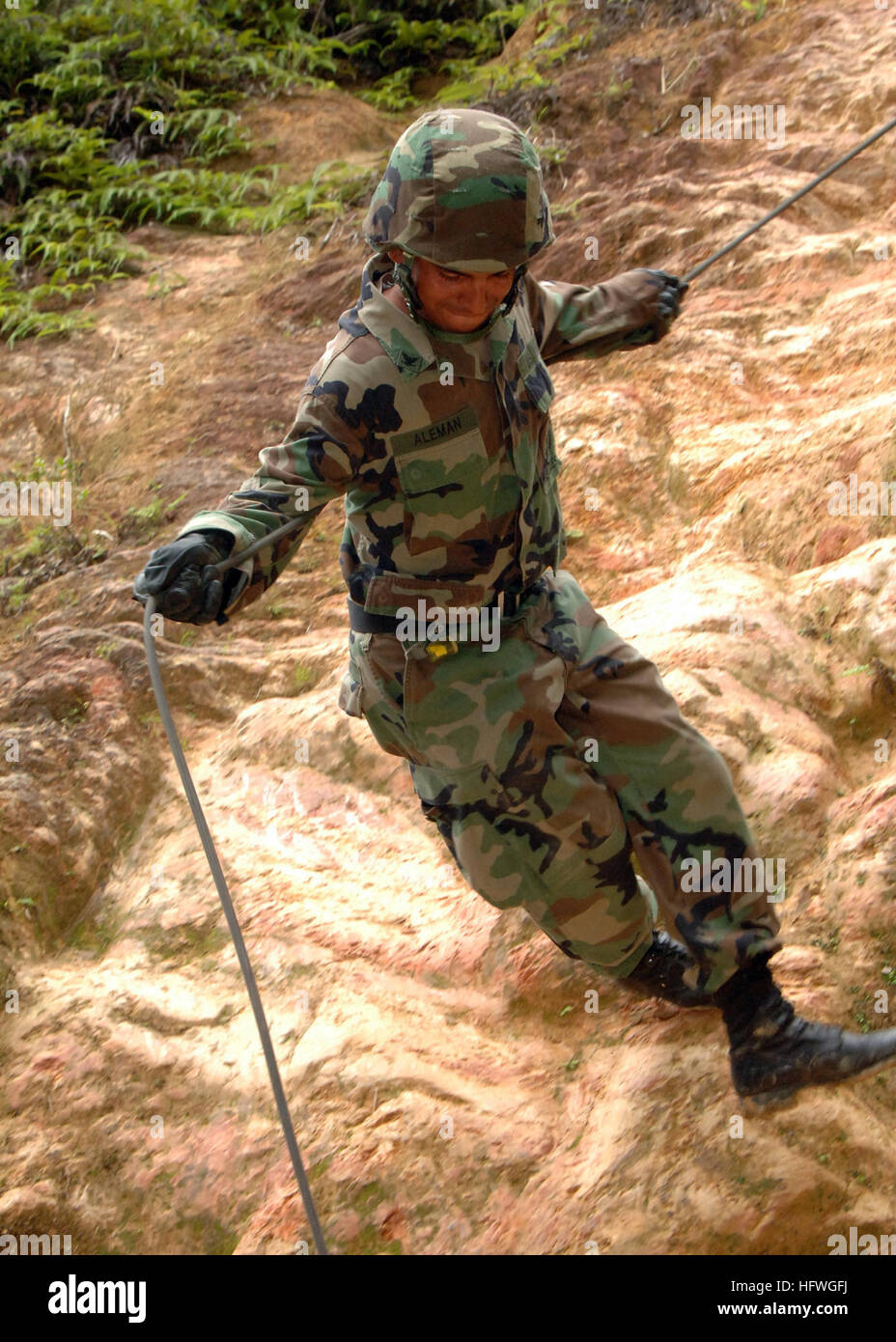 Tactical Rope Operators A Navy equipment operator from NMCB-133 repels down a 50-foot cliff ...